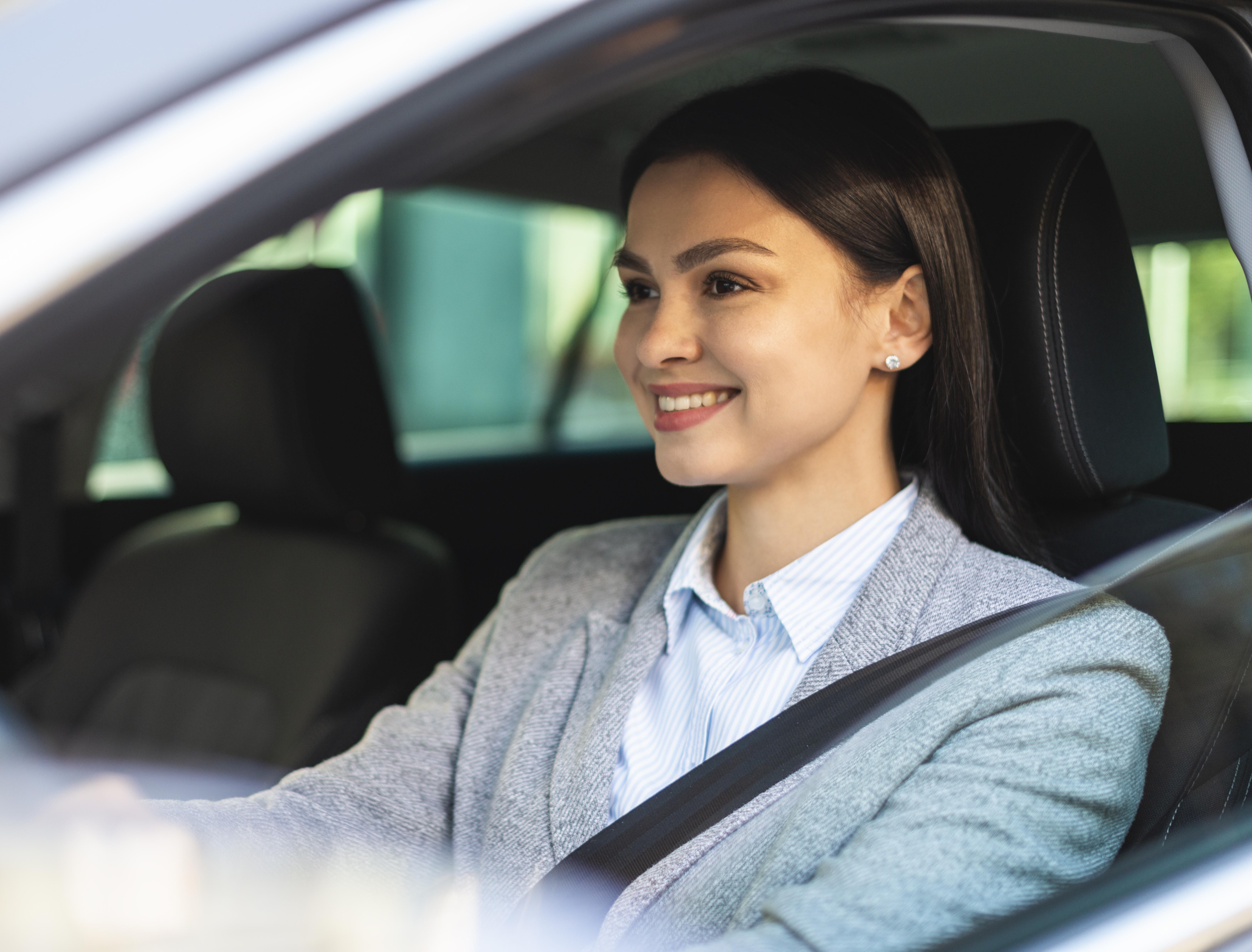 Friendly driving instructor with a student